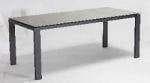 A rectangular table with a light-colored top and clear, straight legs is shown against a plain background.