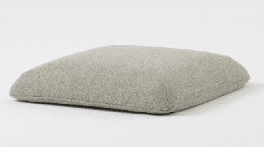 A modern three-seater sofa with light beige upholstered cushions and a dark gray base with black legs is presented on a white background.