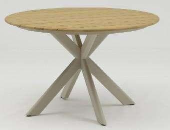 A round dining table with a light-colored top and a unique, intersecting four-legged base.