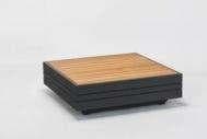 A rectangular outdoor coffee table with a dark grey base and a slatted light brown wooden top.