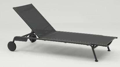 A light-colored outdoor chaise lounge with a padded cushion and wheels on one end is positioned on a plain white background.