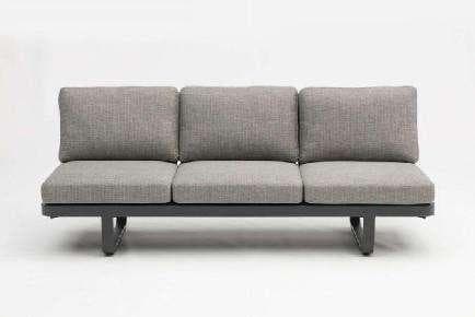 Two round coffee tables with gray tops and dark metal bases are nested together on a white background.